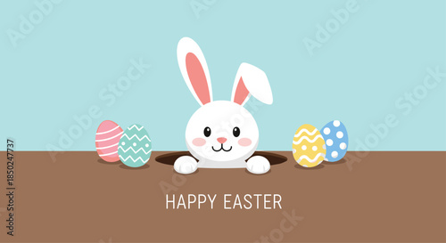 White Easter bunny peeking out of its burrow surrounded by colorful decorated eggs and a happy holiday greeting message.