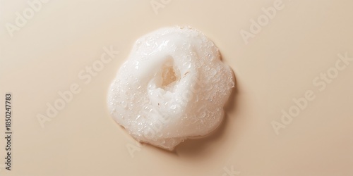 Facial soap foam removing gel-cream layer from face, highlighting cleansing process and skin maintenance