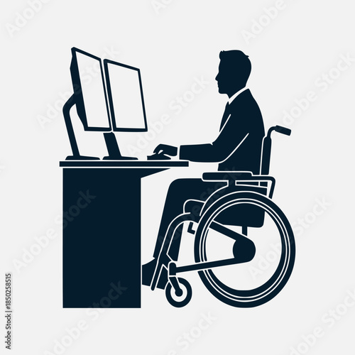 A person in a wheelchair working on a computer with two monitors