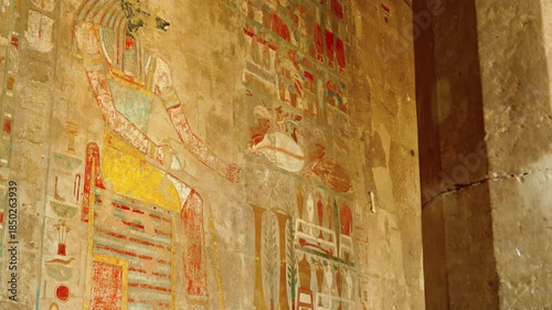 Colored hieroglyphs on the walls of the sacrificial room of the Hatshepsut funeral temple in Luxor. The temple of Ancient Egypt.