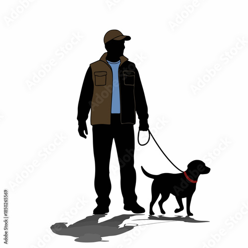 Man walking black dog on leash in urban setting  