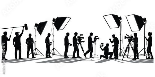 Silhouettes of Film Crew with Cameras and Lighting Equipment Keywords: film, movie, production, crew, camera, video, lighting