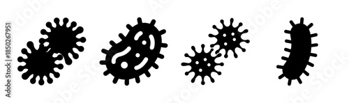 A monochrome illustration of several black spiky shapes resembling stylized microorganisms or seed pods