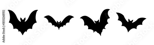 Silhouette illustration of four black bats with wings spread out in different positions