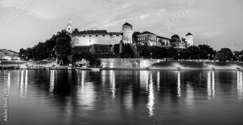 Krakow, Lesser Poland, Poland: Twilight skyline of Wawel Castle and Wawel Cathedral on the shores of river Vistula in black and white
