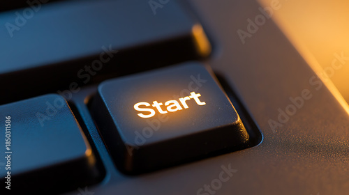 Close up of a glowing start button on a modern keyboard, illuminated with bright orange light, ready to begin a new project or game. Symbolizing initiation and progress.