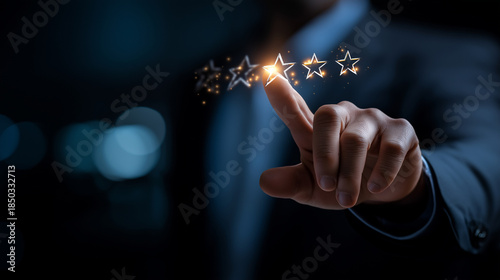 Faceless man in suit touching glowing five star rating interface heavily defocused dark background anonymous professional with quality assessment display customer satisfaction