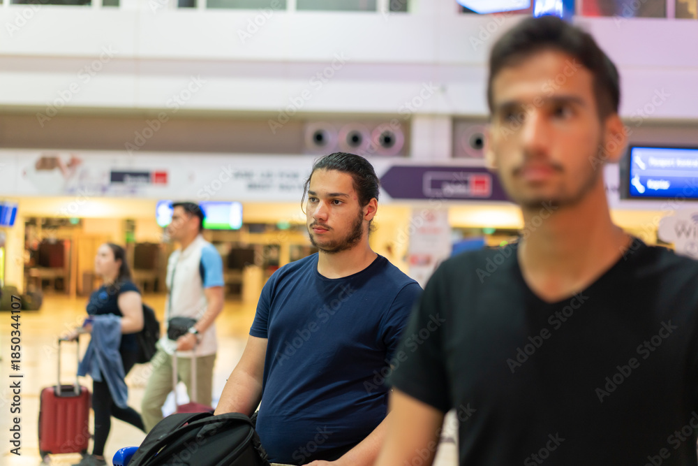 Obraz premium Family waiting in line in the airport. High quality photo