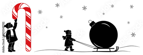 Children silhouettes playing with giant candy cane and christmas ornament in snow