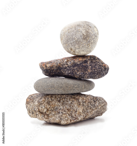 Stack of balancing zen stones isolated on white background.