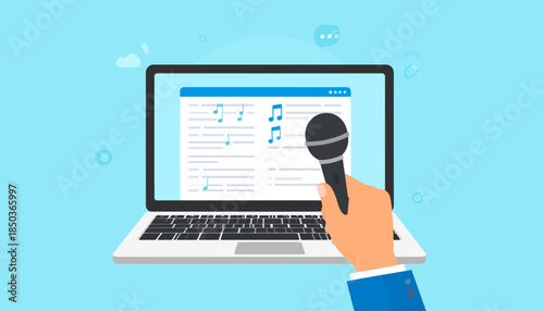 Hand holding microphone near laptop with document on screen.