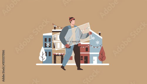 Man carries glass for window repair in a snowy decorated urban street