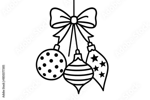 Holiday decorations with ornaments and a bow hanging from a ribbon indoors during winter season