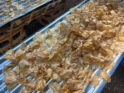 Drying raw Jengkol crackers in The Yard