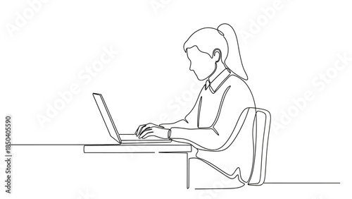 Businesswoman working on laptop in modern office setting