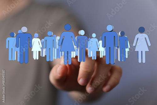 Hand pointing at a crowd of...