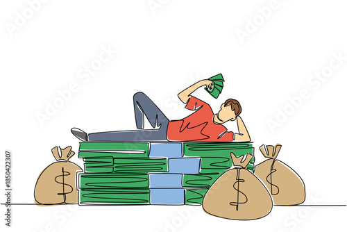 Single continuous line drawing a man lying on a pile of banknotes and fanning himself with the banknotes. Very abundant wealth. Achievement. Be a Millionaire Day. One line design vector illustration