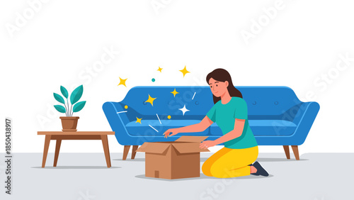 Woman unpacking box in living room with blue sofa