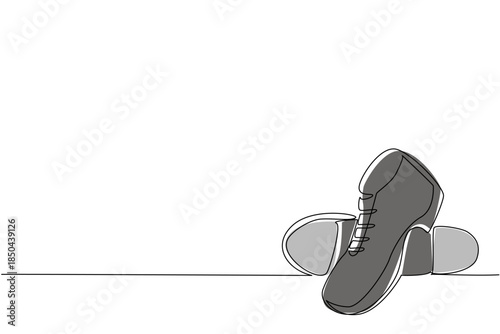 Single one line drawing tap dance shoes with a metal plate on the bottom. Shoes of men specifically for dancing. Made of leather. National Tap Dance Day. Continuous line design graphic illustration