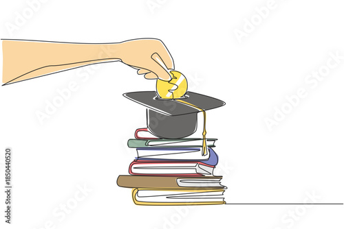 Single one line drawing hand holds coin inserting them into graduation cap and pile of thick books underneath. Serious about education. College Savings Day. Continuous line design graphic illustration