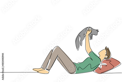 Single continuous line drawing a man in casual clothes lying down lifting and hugging a cat. Adorable game with pet cat. Cheerful. International Hug Your Cat Day. One line design vector illustration