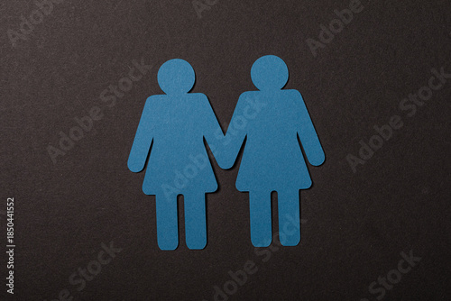 Two blue paper cutout figur...