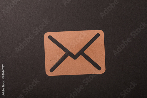 A brown envelope cutout aga...
