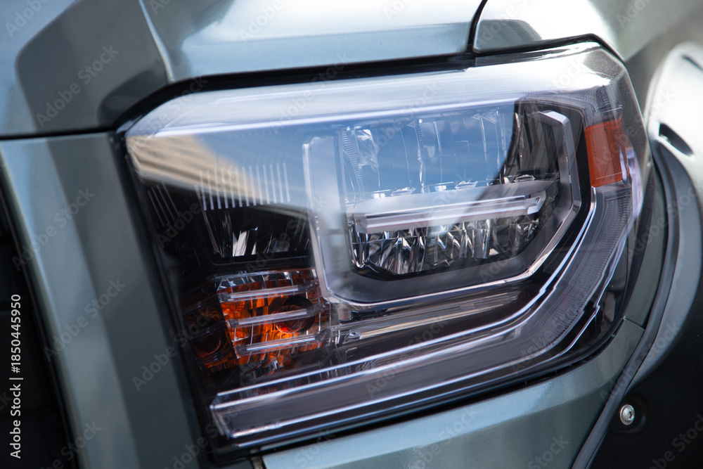 Fototapeta premium Modern pickup truck LED headlight detail.