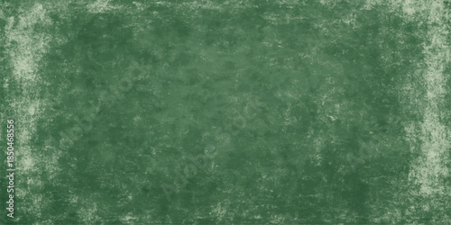 A vintage green grunge texture with a dark aged pattern on a rough paper backdrop creates an old dirty wall design for an art canvas wallpaper