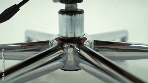 Office chair base, close-up details, chrome finish, abstract, white background, for business, design