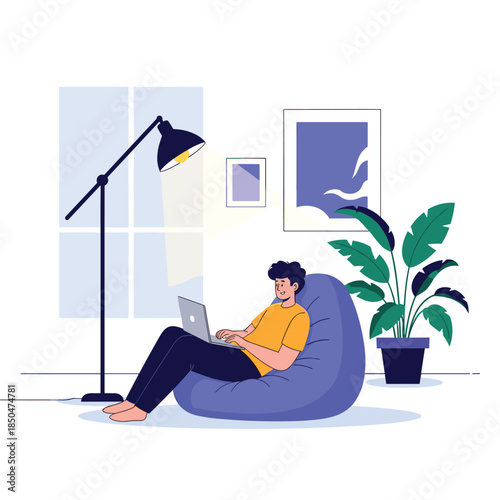 Comfortable home office setup shows a man sitting in a purple bean bag chair while working on a laptop computer during the day.