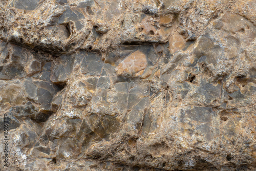 Close-up of stone surface. Brown stone texture, background.