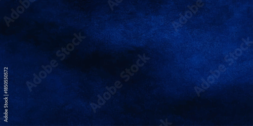 Dark blue grunge background with a vintage textured pattern featuring rough paint on an old paper and canvas wall backdrop for an artistic design