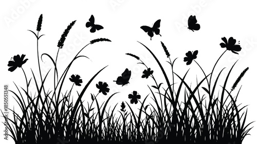 Silhouette of tall grass and wildflowers with butterflies fluttering gently in the breeze, evoking a sense of natural beauty and tranquility