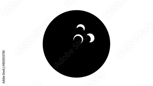 Black bowling ball with finger holes, a sport accessory, on an isolated white background.