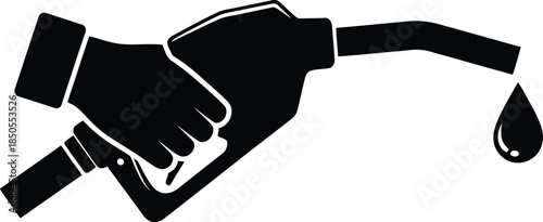 Hand holding black gas pump nozzle with dripping liquid