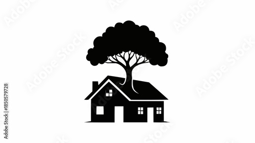 Silhouette of a house with a large tree growing from its roof.