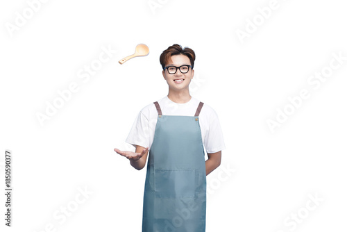 Mastering Kitchen Arts: A smiling chef juggles a wooden spoon with a sprinkle of seasoning, his focus on creating culinary excellence