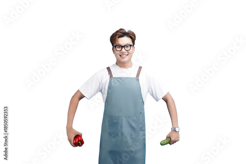 Cheerful Chef with Fresh Produce: A smiling chef holds up fresh vegetables, embodying the essence of healthy cooking and culinary artistry.