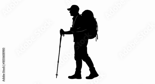 Silhouette of a hiker with a backpack and trekking pole.