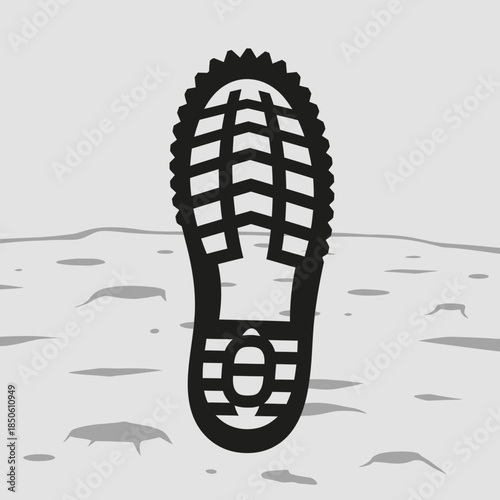 Black boot print on textured gray surface with craters.