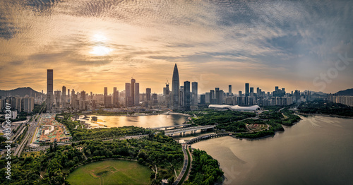 Foto Panoramic aerial view of Shenzhen city skyline with modern buildings and a river at sunset