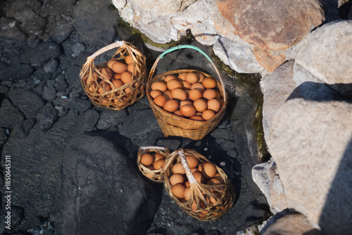 Eggs boiled in natural hot water by simply soaking the eggs in a mineral spring with a temperature of up to 82 degrees Celsius at Chaeson National Park, Lampang, Thailand.