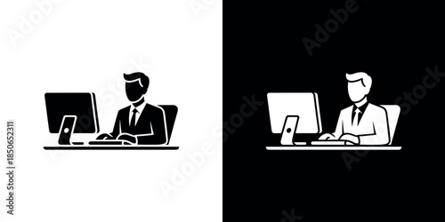 A businessman working at a desk with a computer shown in dual tones