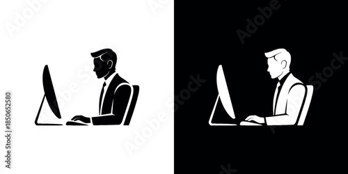 A man working on a computer shown in both positive and negative contrast