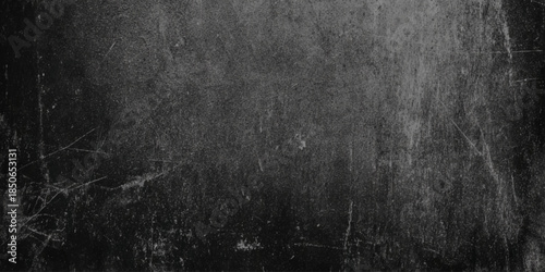 An abstract textured surface with a grunge or distressed look mostly dark gray, and light gray background in graphic design, web design.