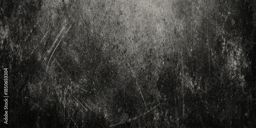 An abstract textured surface with a grunge or distressed look mostly dark gray, and light gray background in graphic design, web design.