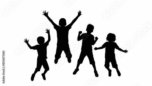 Silhouette of four happy children jumping in the air.