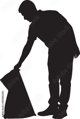 Man in silhouette picking up trash into a bag, illustrating efforts for a cleaner environment and community service. , Generative Ai