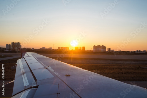 Sunset sky on airplane, plane window, over Copenhagen, Denmark, Scandinavia, Europe in Friday evening flight for relax in holiday